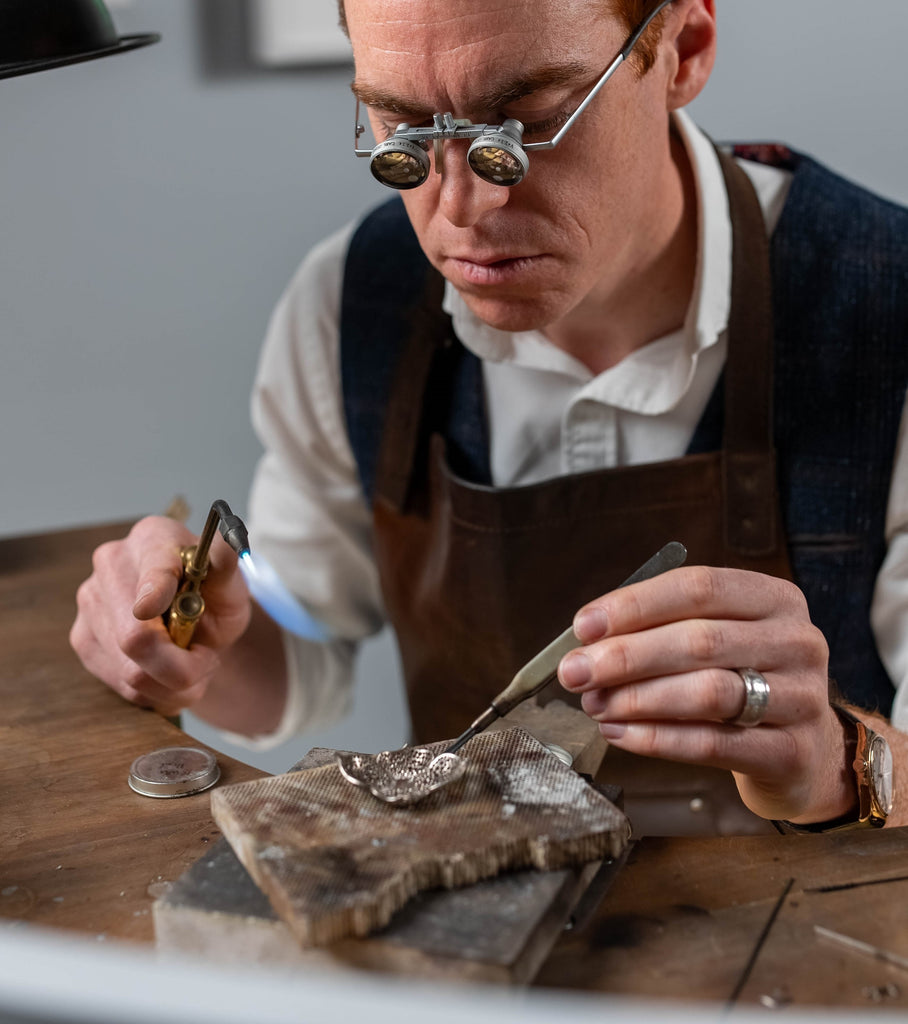 Matthew Ely behind the jewellery bench